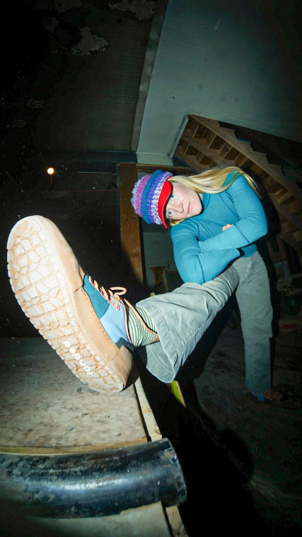Gracee, Landed Collective member, showing off a Landed outsole at an indoor skate spot