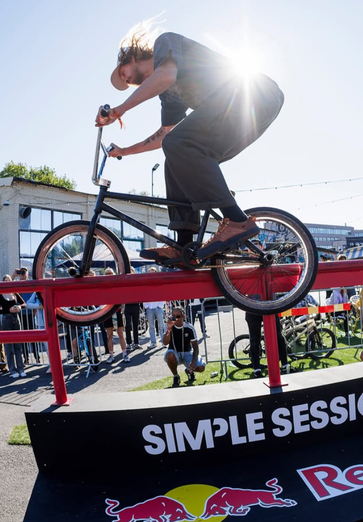 Reed Stark, Landed Collective member, riding a BMX rail at Simple Session in Landed shoes
