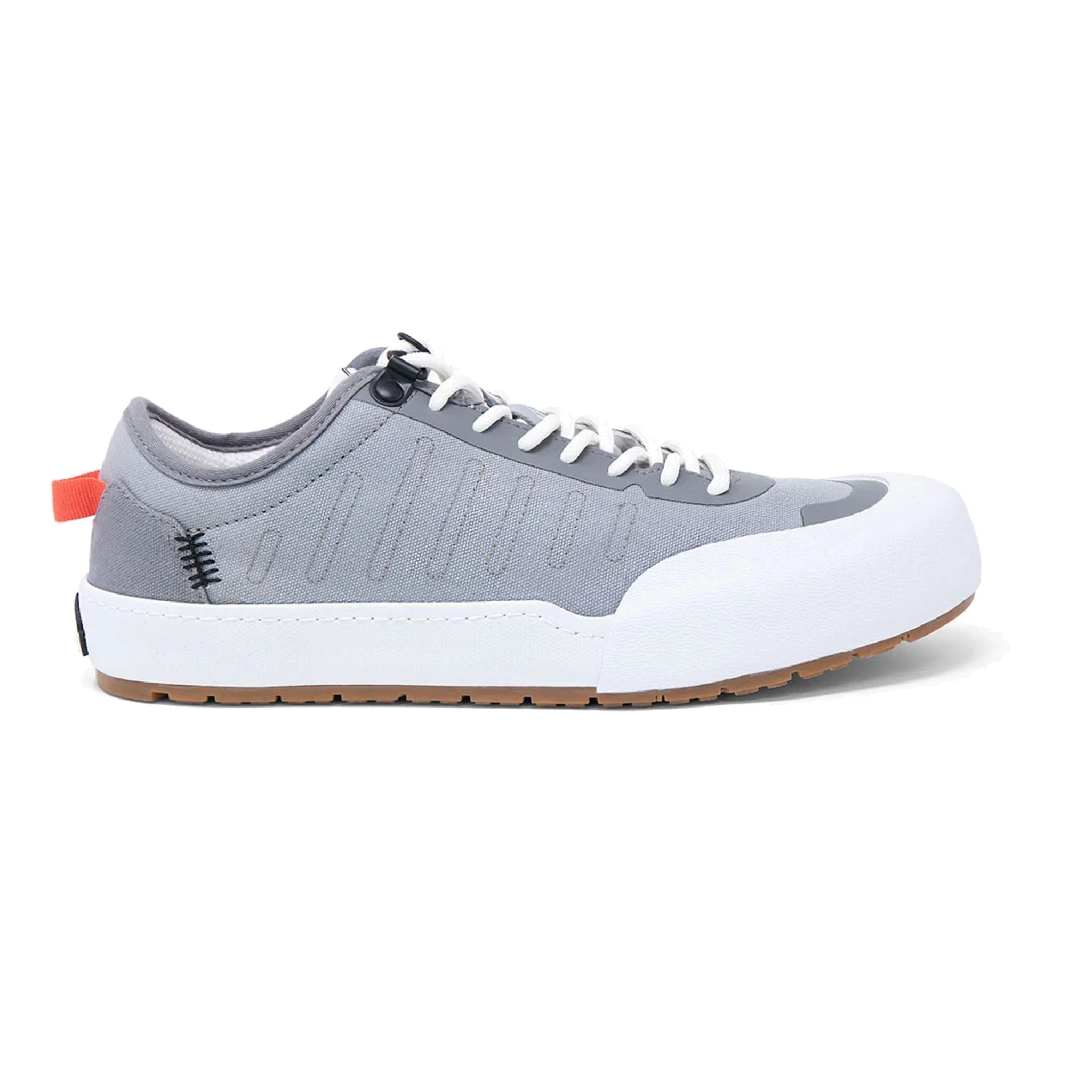 Landed The Overlook 1.0 grey technical sneaker with white rubber toe cap, white laces, and orange heel pull tab.