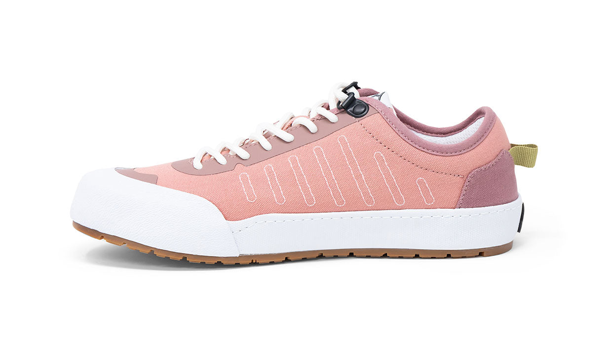 Landed The Overlook 1.0 technical sneaker in dusty pink with white rubber toe cap and gum sole, side view.