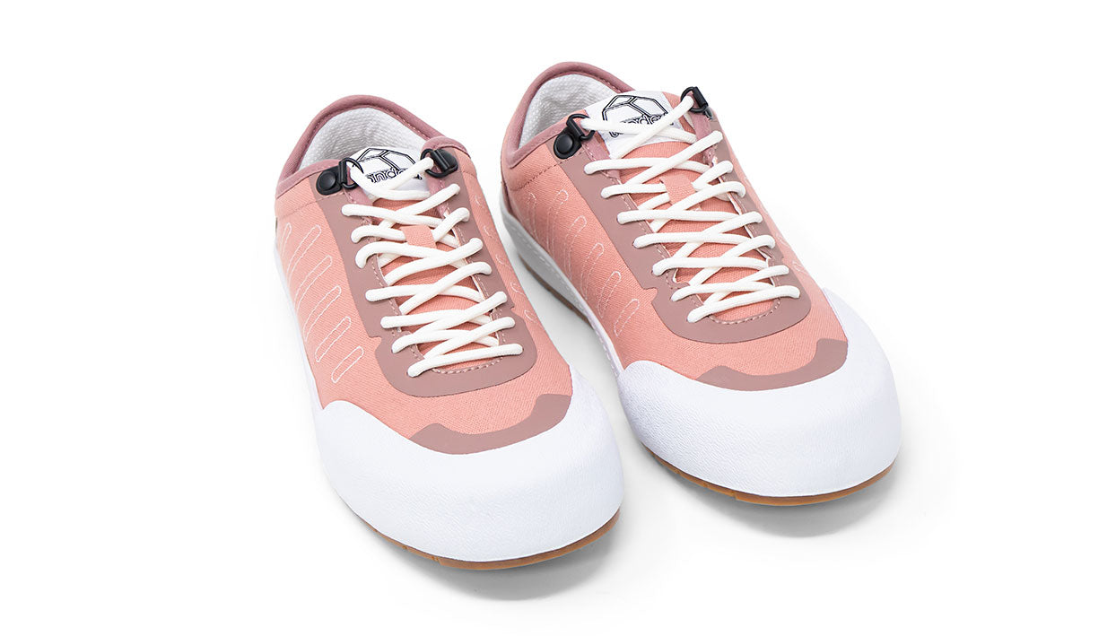 Landed The Overlook 1.0 technical sneakers in dusty rose pink with white soles and laces on a white background