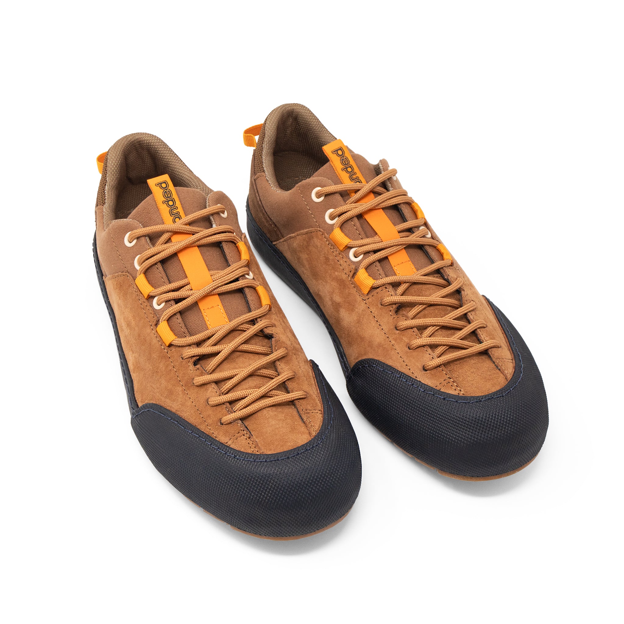 Landed The Switchback brown suede approach shoes with orange accents and black rubber toe caps on a white background.