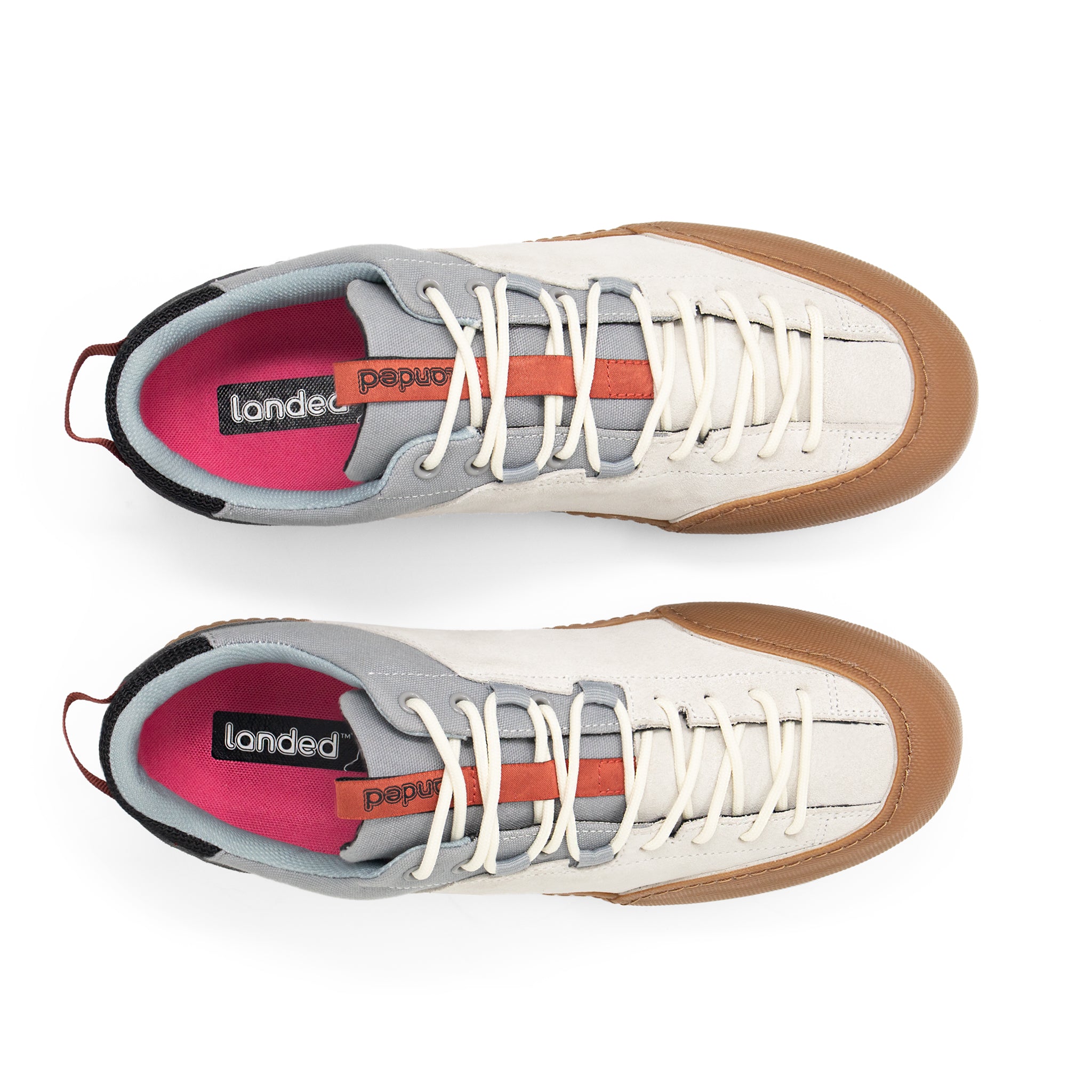 Landed The Switchback sneakers in cream and grey with a gum rubber toe cap and full-length lacing system.