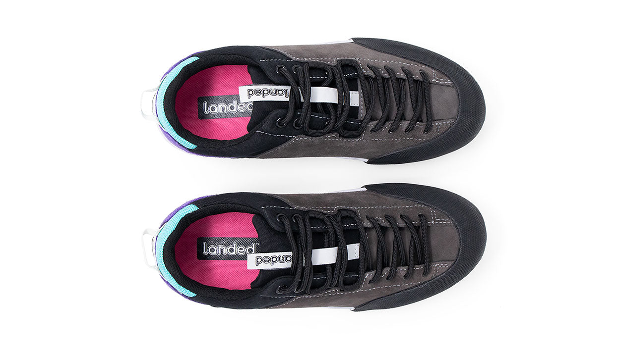Landed The Switchback grey suede approach shoes with full-length lacing, black rubber toe caps, and pink insoles.