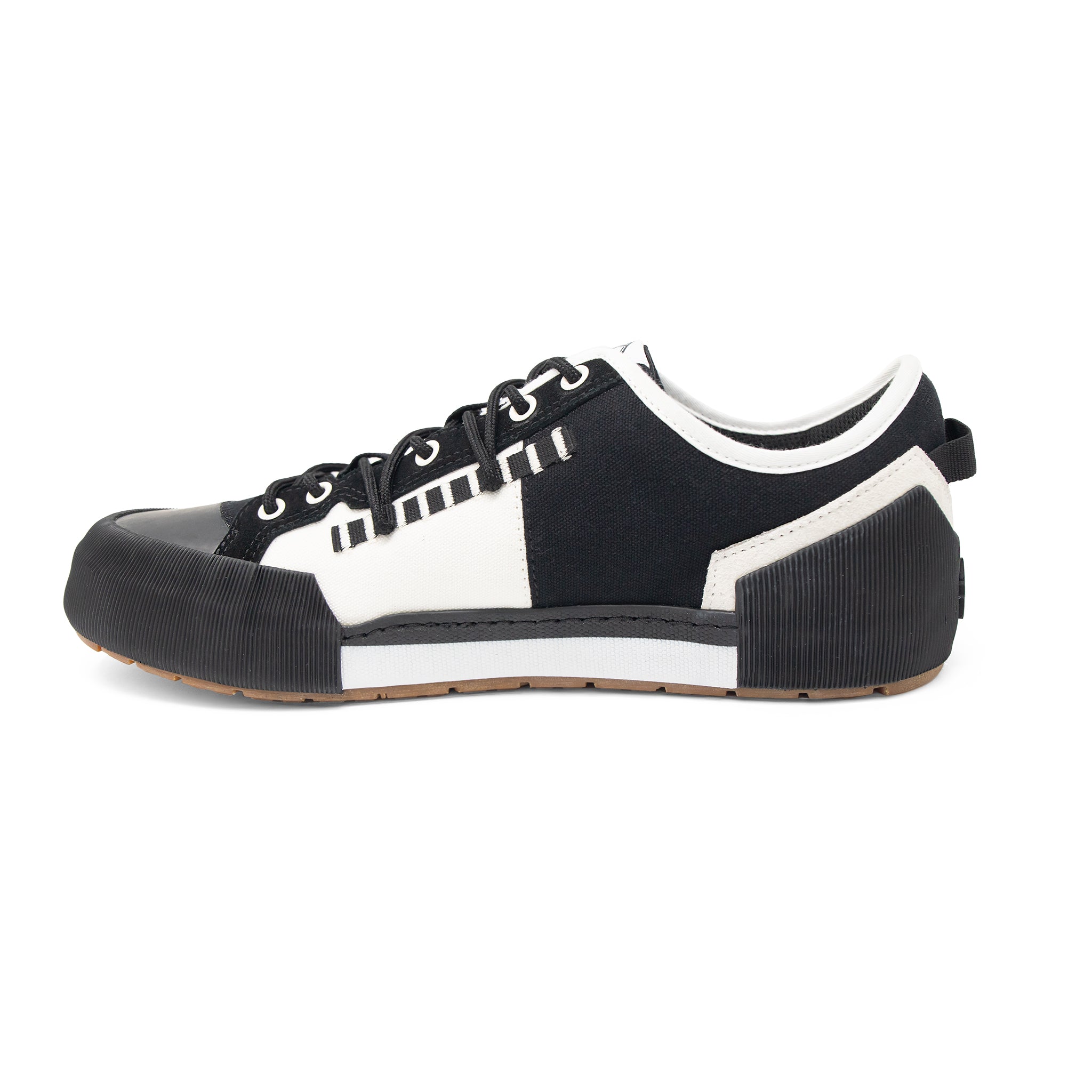 Landed The Banner sneaker in black and white with a technical silhouette and thick rubberized sole detail.