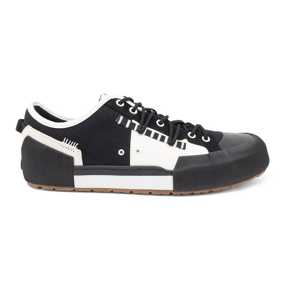 Landed The Banner sneaker in black and white canvas with a chunky rubber toe cap and textured midsole side view - Black Bad Badger Limited