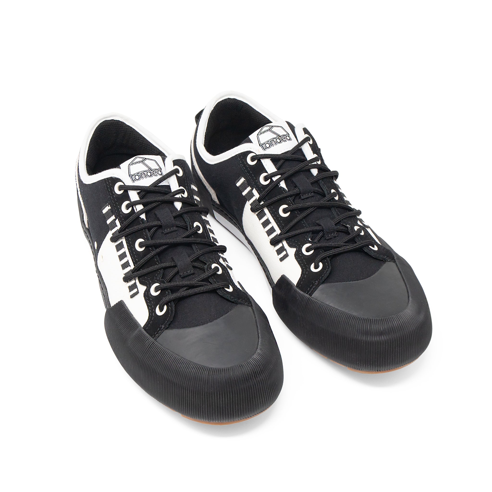 Landed The Banner black and white technical sneakers with a reinforced rubber toe cap and lace-up closure