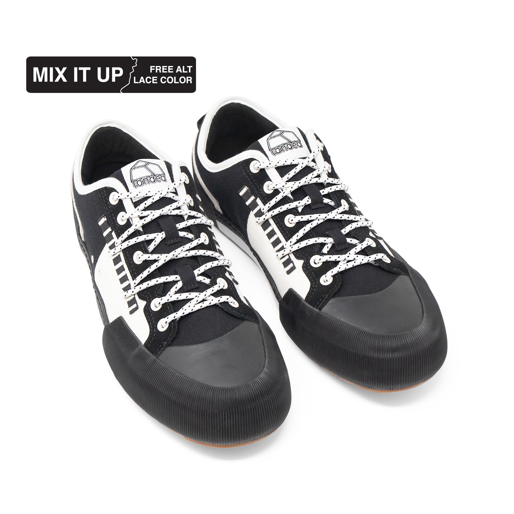 Landed The Banner black and white technical sneakers with patterned laces and a reinforced rubber toe cap