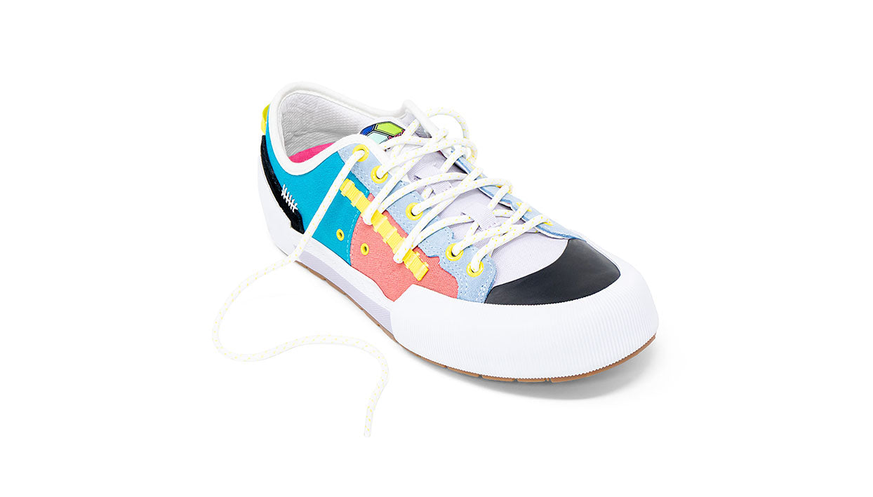 Landed The Banner sneaker featuring a multi-colored technical design with white, blue, pink, and yellow accents.