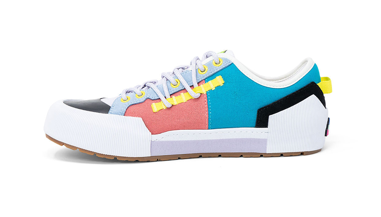 Landed The Banner sneaker featuring a multi-colored canvas design with blue, pink, and yellow accents.
