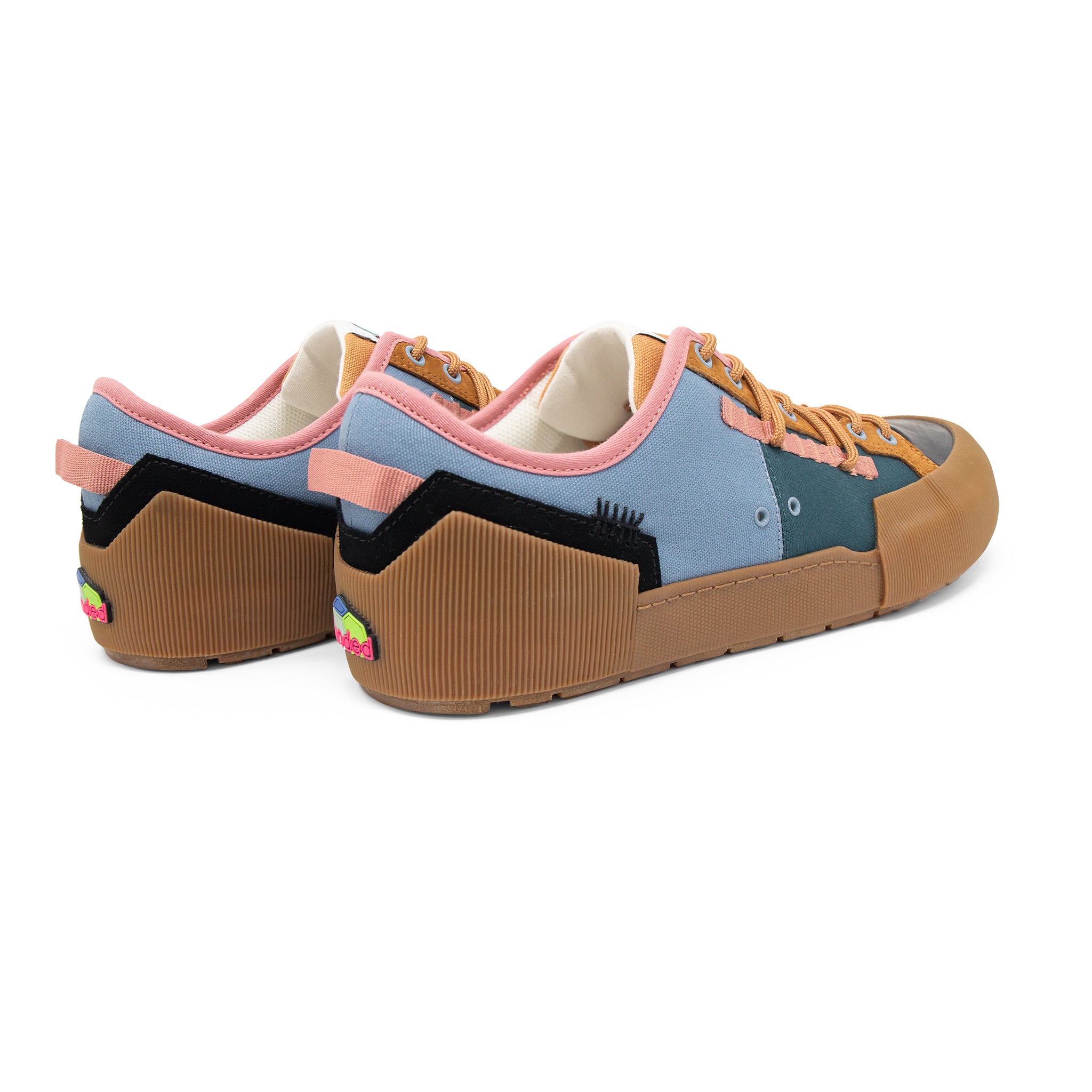 Landed The Banner sneakers featuring a multi-colored technical design with blue, pink, and brown panels.
