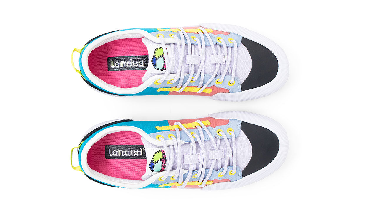 Landed The Banner sneakers in a vibrant multi-color design with white mesh, pink, blue, and yellow accents.