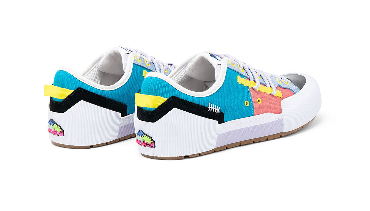 Landed The Banner sneakers featuring a multi-colored technical design with teal, pink, and yellow accents.
