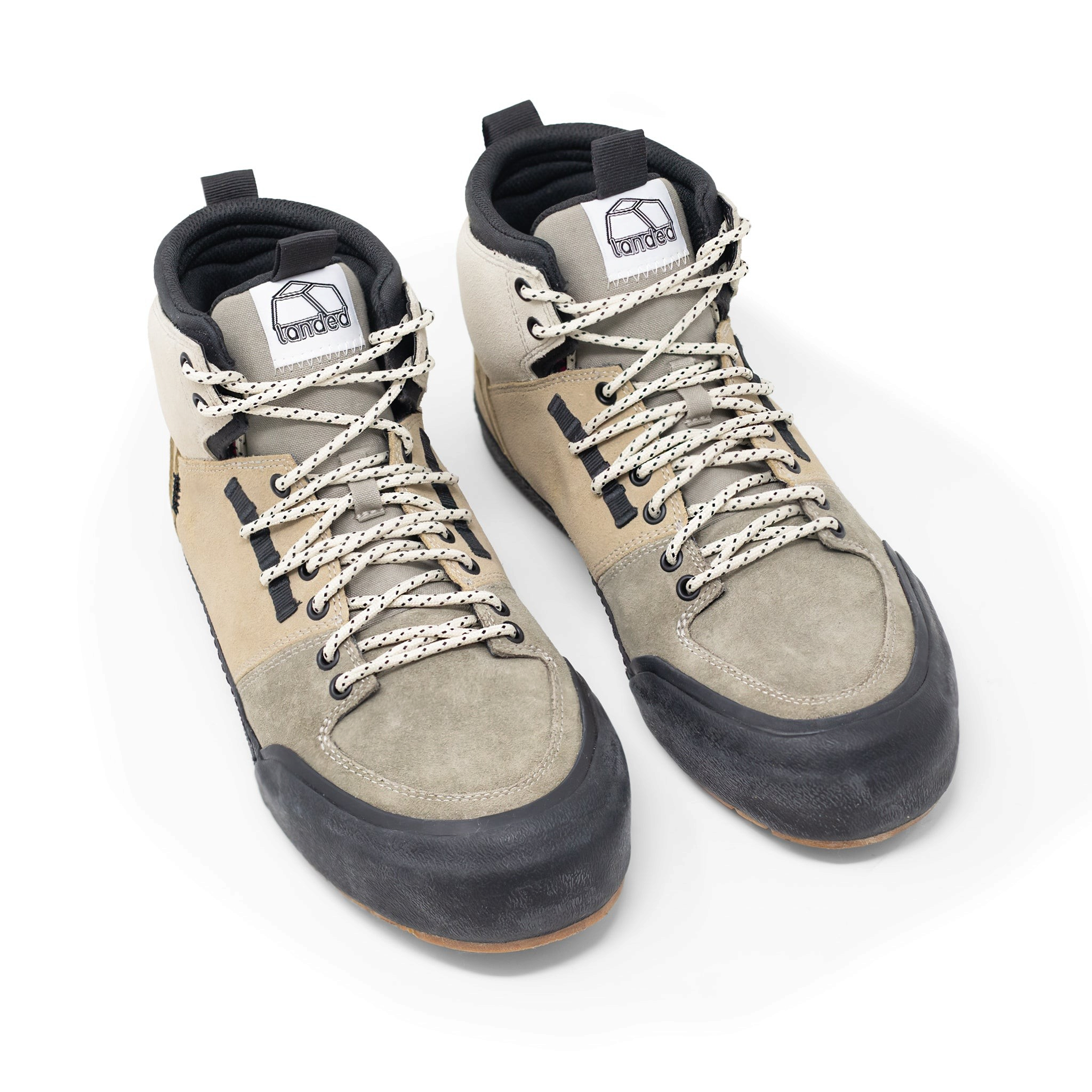 Landed The Elevate high-top sneakers in beige and olive suede with black rubber toe caps and patterned laces.