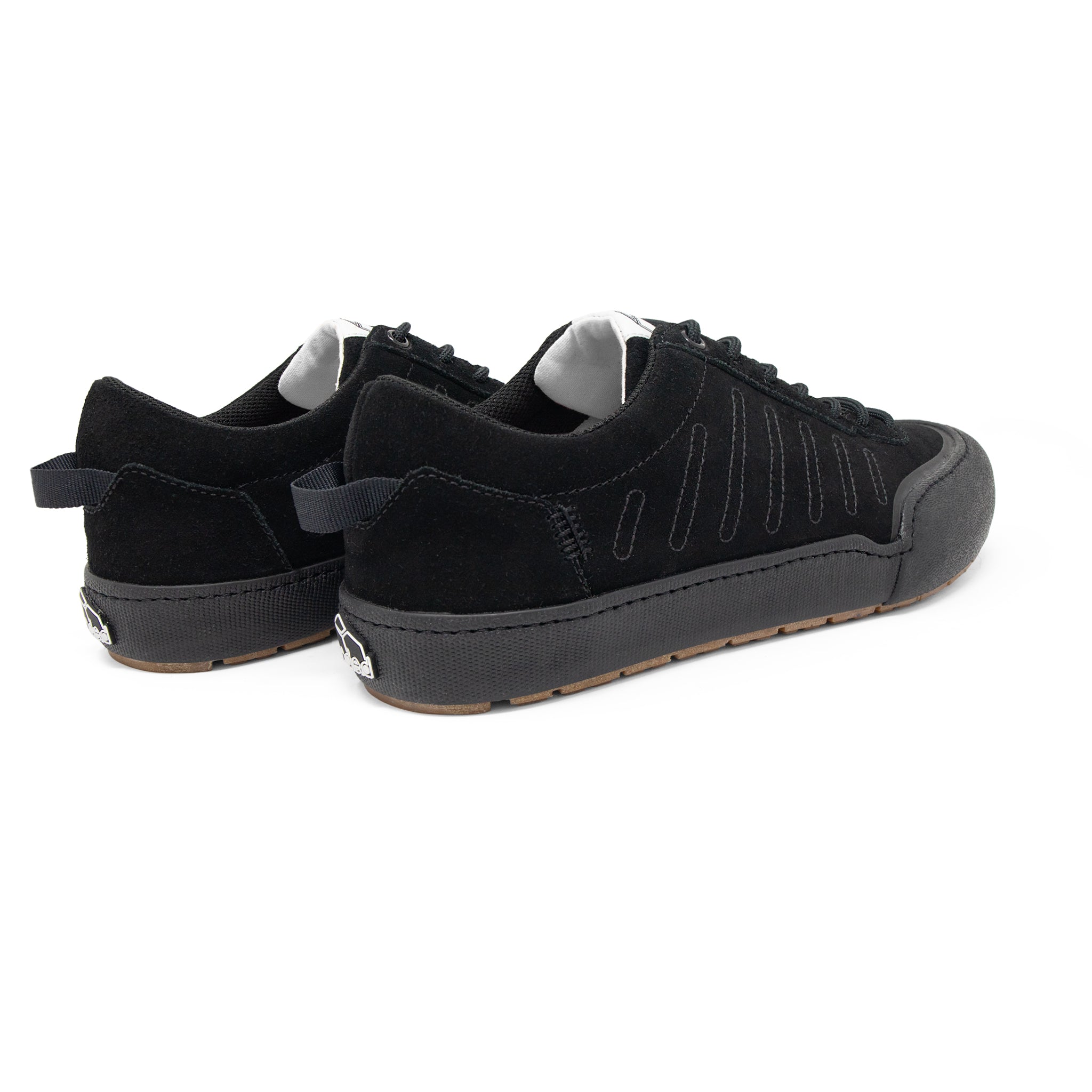 Landed The Overlook 2.0 black technical sneakers with suede detailing and a durable rubber sole, rear view.