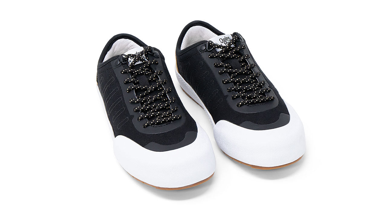 Landed The Overlook 1.0 technical sneakers in black with white rubber toe caps and speckled laces