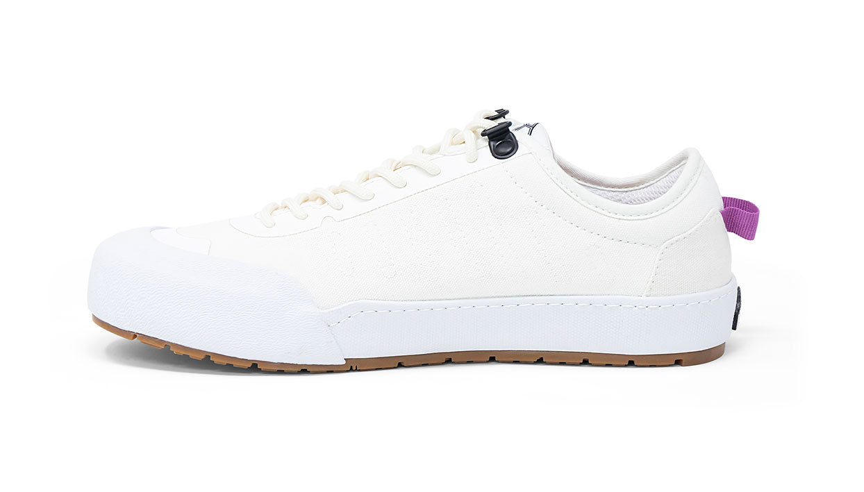 Landed The Overlook 1.0 white canvas technical sneaker with a gum rubber sole and purple heel pull tab
