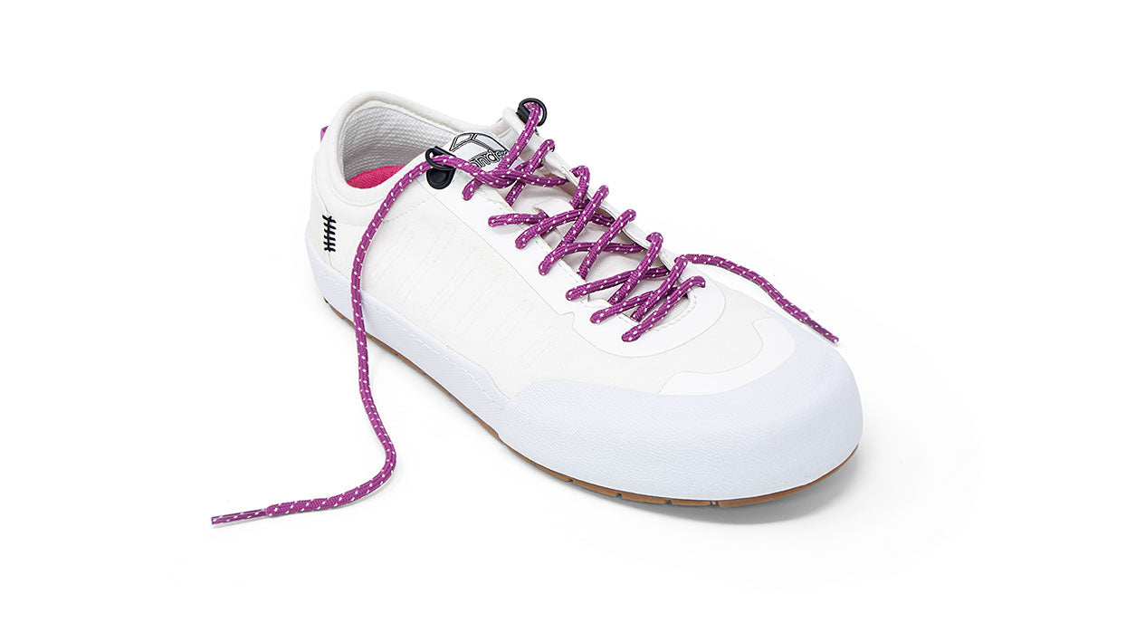 Landed The Overlook 1.0 white technical sneaker with purple patterned laces and a gum rubber sole