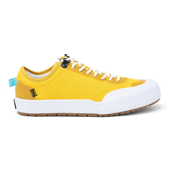 Landed The Overlook 1.0 yellow technical sneaker with white rubber toe cap and gum sole, side view. - Golden Spike